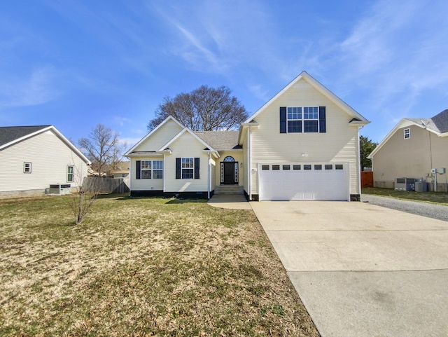 traditional home featuring an attached garage, a front yard, fence, cooling unit, and driveway