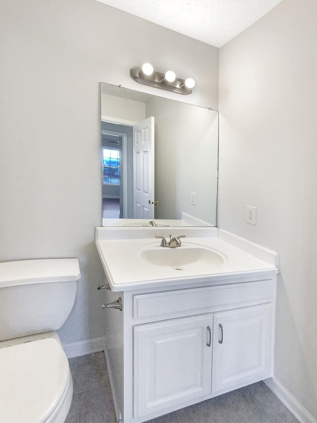 1173 Snoopy Dr, Clarksville, TN 37040 - half bathroom with a textured ceiling, vanity, toilet, and baseboards