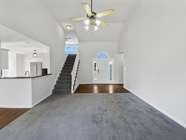 1173 Snoopy Dr, Clarksville, TN 37040 - entrance foyer featuring high vaulted ceiling, carpet floors, a ceiling fan, baseboards, and stairs