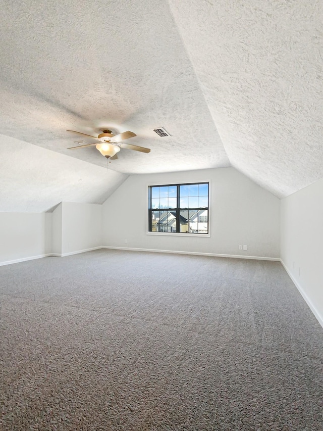 1173 Snoopy Dr, Clarksville, TN 37040 - additional living space with carpet flooring, vaulted ceiling, visible vents, and baseboards