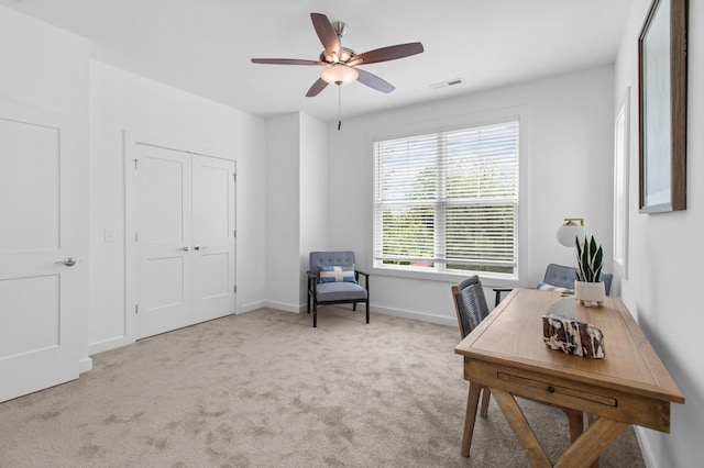 office area with baseboards, carpet, visible vents, and a ceiling fan