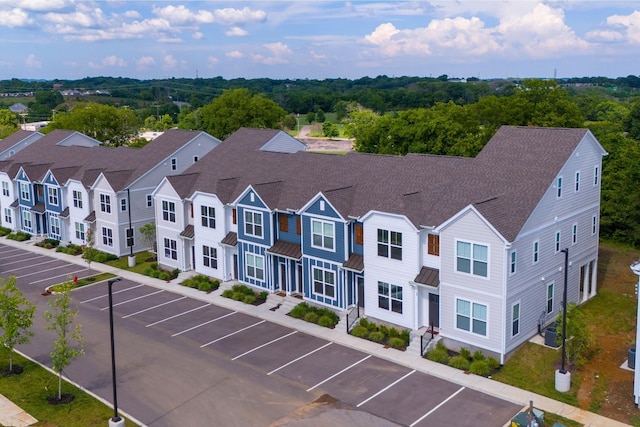 birds eye view of property with a residential view