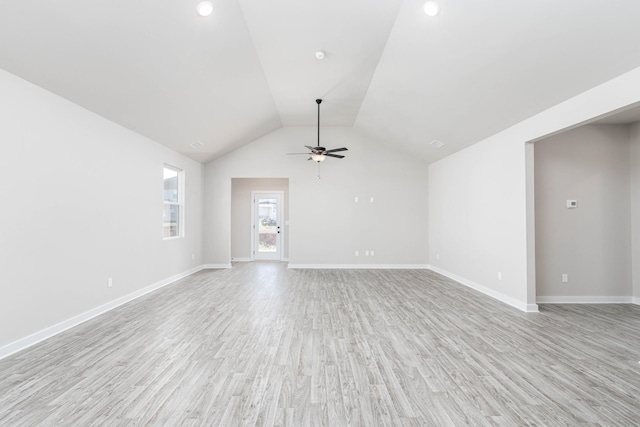 unfurnished living room with vaulted ceiling, baseboards, light wood-style flooring, and a ceiling fan