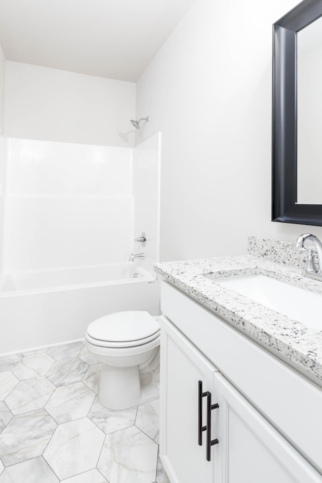 full bathroom featuring  shower combination, marble finish floor, vanity, and toilet