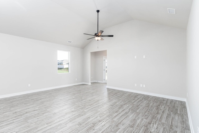 empty room featuring light wood-style floors, ceiling fan, visible vents, and baseboards