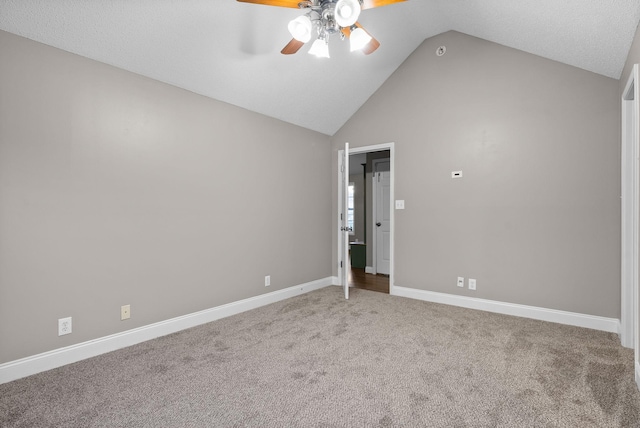 empty room featuring light carpet, baseboards, vaulted ceiling, and a ceiling fan