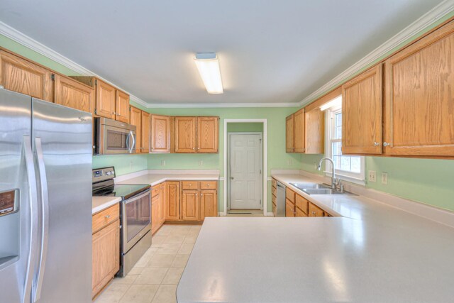 kitchen featuring crown molding, light countertops, light tile patterned floors, stainless steel appliances, and a sink