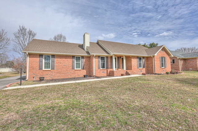 single story home with a front yard, roof with shingles, a chimney, crawl space, and brick siding