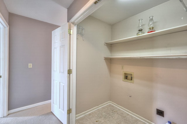 clothes washing area featuring washer hookup, laundry area, baseboards, and hookup for an electric dryer