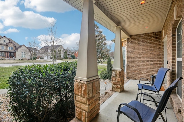 view of patio with a porch and a residential view