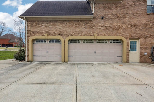 garage featuring driveway