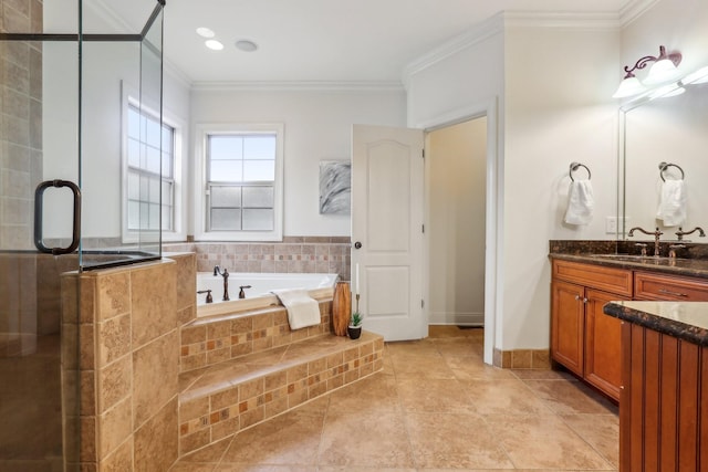 full bathroom featuring ornamental molding, a shower stall, baseboards, a bath, and vanity