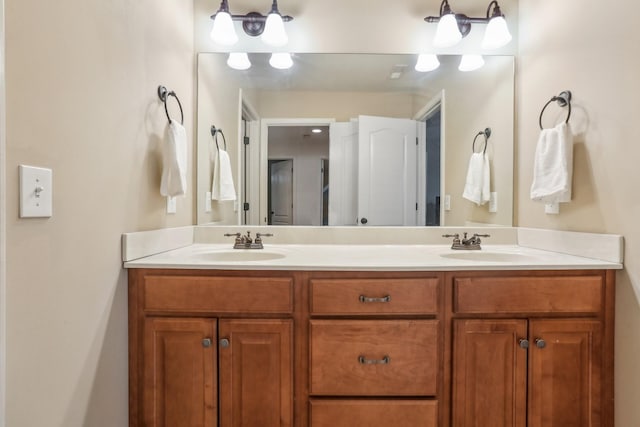 full bath with double vanity and a sink