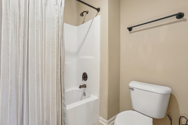 bathroom featuring toilet and shower / bath combo