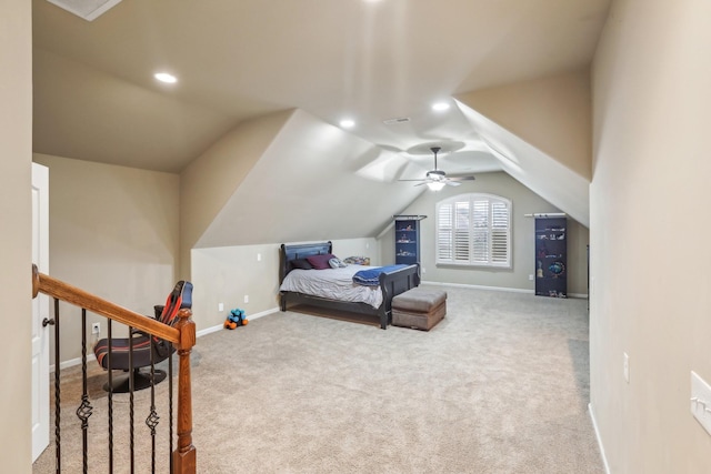 carpeted bedroom featuring vaulted ceiling, visible vents, baseboards, and ceiling fan