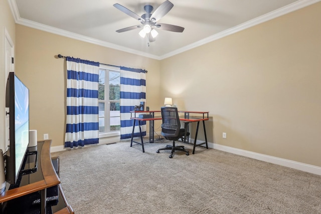 home office with baseboards, carpet, ornamental molding, and a ceiling fan