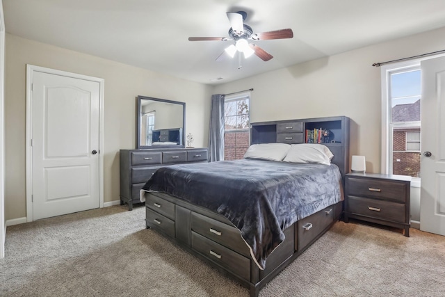 bedroom with baseboards, light carpet, and ceiling fan