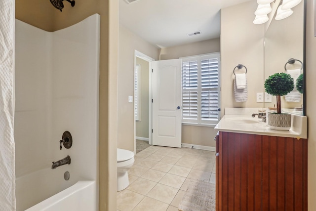 full bathroom with tile patterned floors, toilet, baseboards, bathing tub / shower combination, and vanity