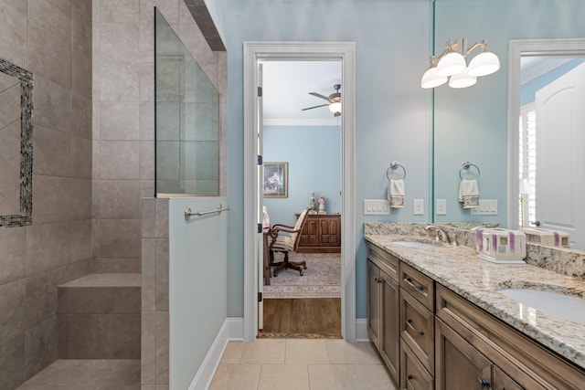 bathroom with crown molding, a sink, and a walk in shower