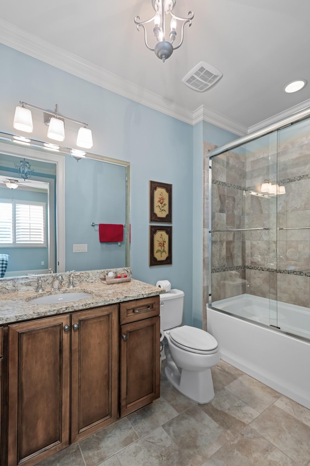 bathroom featuring toilet, ornamental molding, vanity, and visible vents