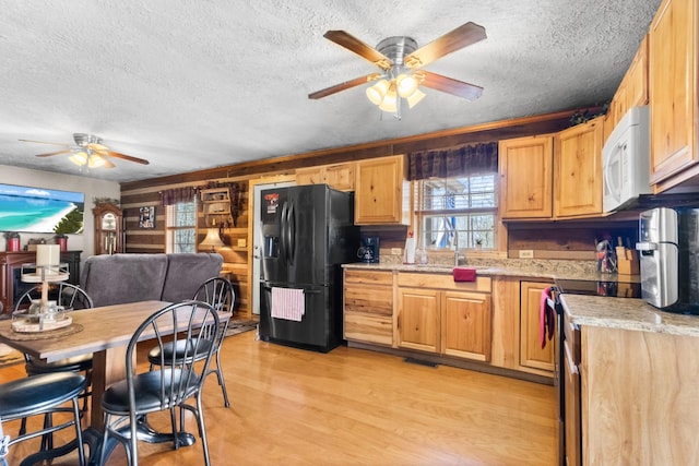 kitchen with ceiling fan, white microwave, light wood-style flooring, stainless steel electric range, and black refrigerator with ice dispenser