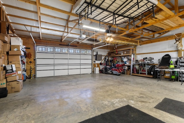 garage featuring a garage door opener and electric panel