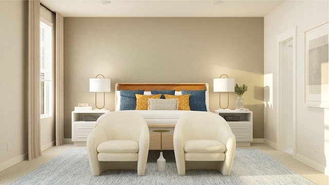 bedroom featuring light colored carpet and baseboards