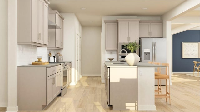 kitchen with light wood-type flooring, a kitchen island with sink, stainless steel refrigerator with ice dispenser, and electric range oven