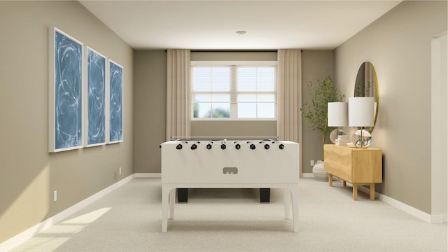 rec room featuring carpet flooring and baseboards