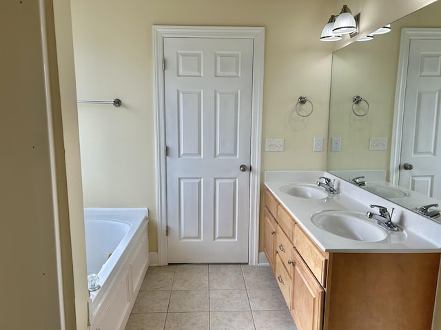 bathroom with double vanity, a sink, and tile patterned floors