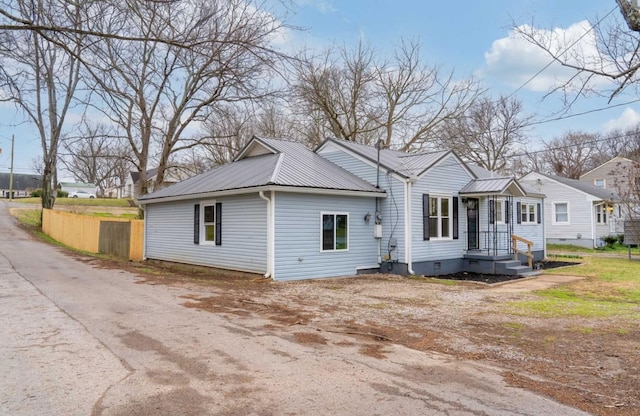 exterior space with metal roof