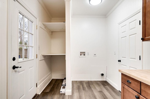 washroom featuring washer hookup, dark wood finished floors, crown molding, electric dryer hookup, and laundry area