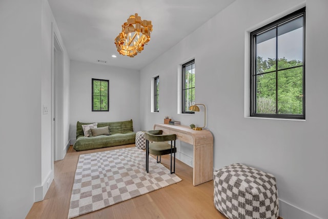living area with visible vents, a chandelier, baseboards, light wood-type flooring, and recessed lighting