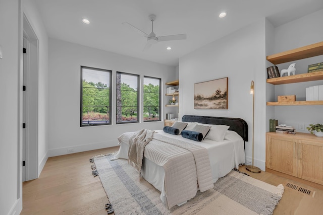 bedroom with baseboards, visible vents, light wood-style flooring, and recessed lighting
