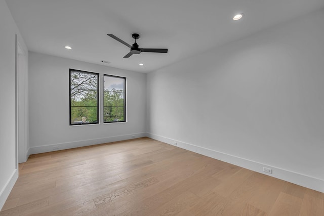 unfurnished room with visible vents, recessed lighting, ceiling fan, baseboards, and light wood-type flooring