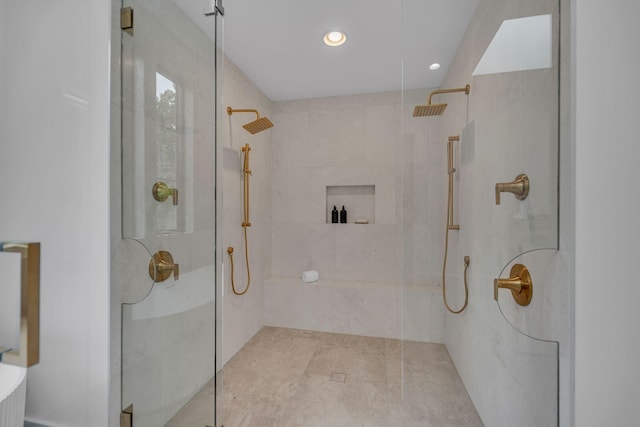 bathroom with walk in shower and recessed lighting