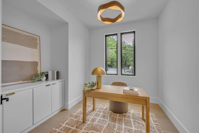 office space with baseboards