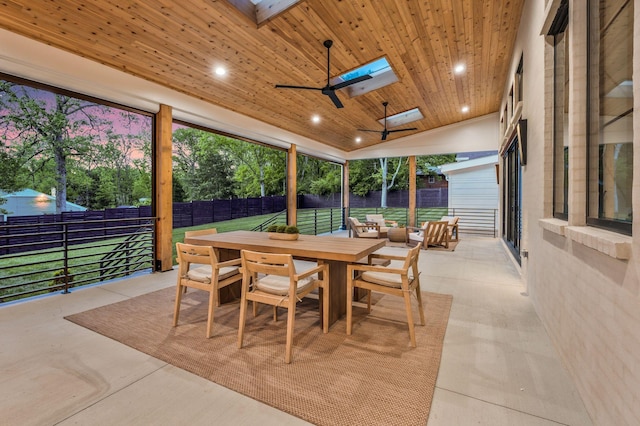 view of patio / terrace with outdoor dining space, a ceiling fan, and a fenced backyard
