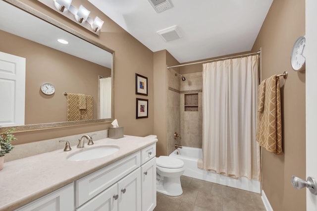 full bathroom with visible vents, toilet, shower / bath combo, vanity, and tile patterned flooring