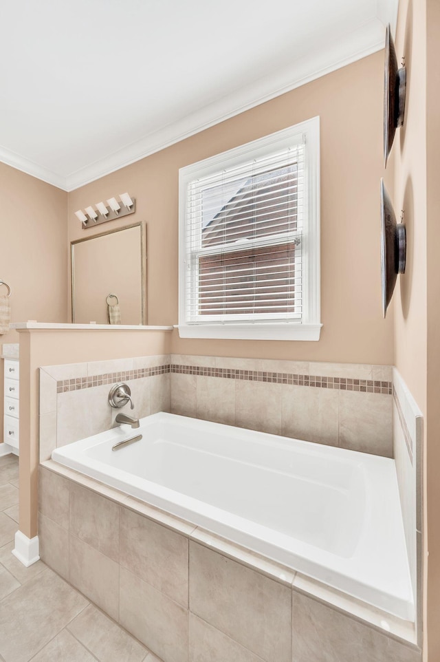 bathroom with ornamental molding, a garden tub, and tile patterned floors