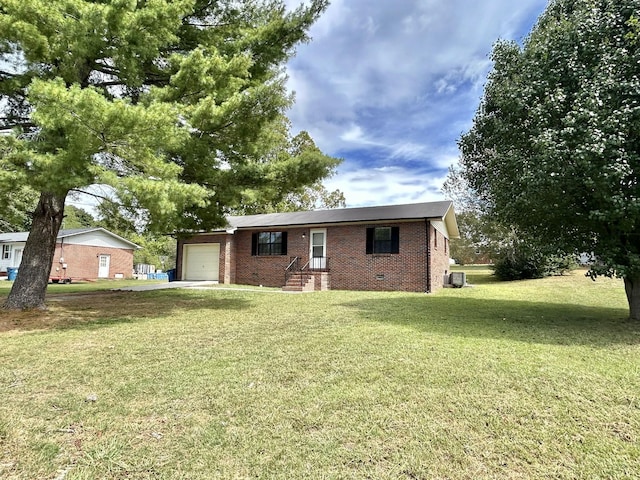 ranch-style home with crawl space, a garage, a front lawn, and brick siding