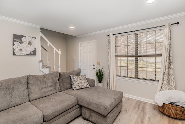 living area with baseboards, stairway, ornamental molding, light wood-type flooring, and recessed lighting