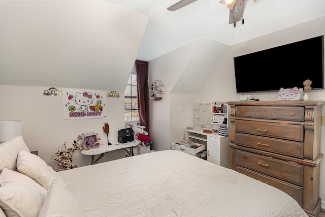 bedroom featuring a ceiling fan, vaulted ceiling, and a textured ceiling