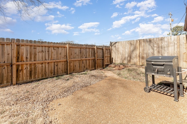 view of yard with a patio area and a fenced backyard