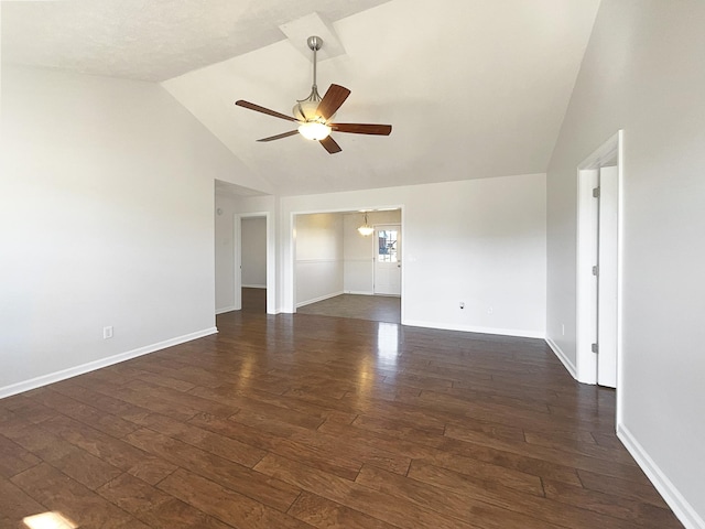 empty room featuring dark wood-style floors, ceiling fan, high vaulted ceiling, and baseboards