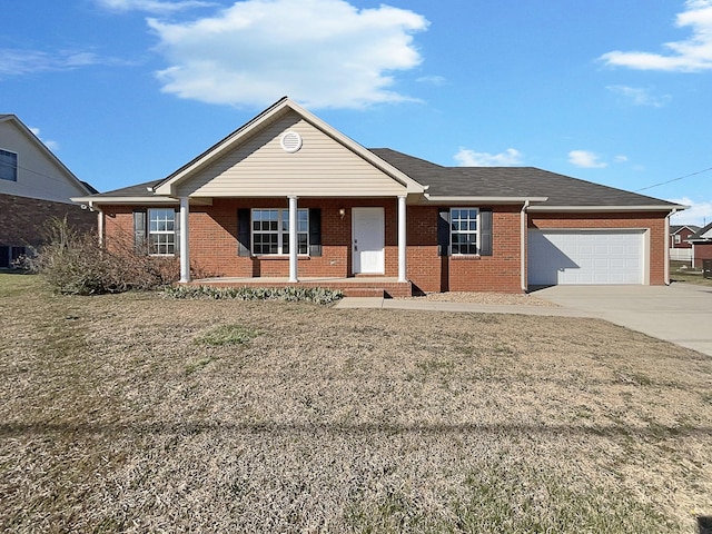 single story home with driveway, covered porch, a garage, and brick siding