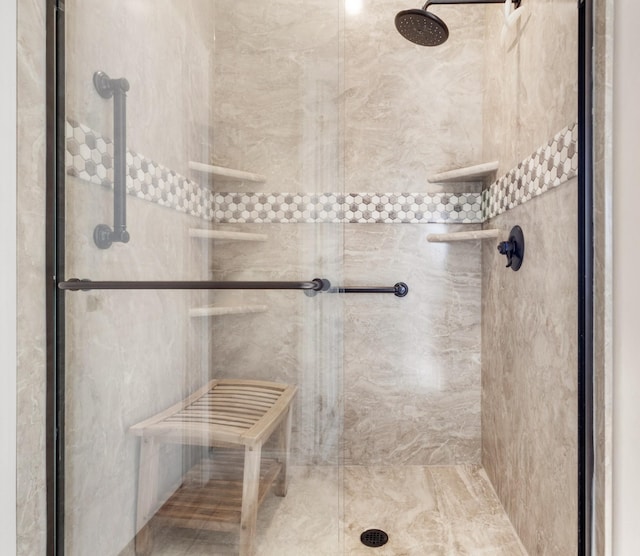 full bath with a shower stall