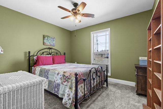 bedroom with visible vents, baseboards, ceiling fan, and carpet flooring