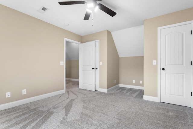 unfurnished bedroom featuring carpet floors, visible vents, baseboards, and a ceiling fan