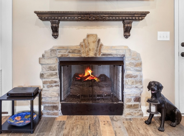 4268 Sango Rd, Clarksville, TN 37043 - detailed view of a fireplace, wood finished floors, and baseboards